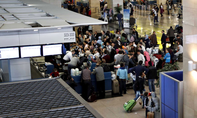 People wait for flight at Cairo International Airport on January 31, 2011 in Cairo, Egypt. [Photo/Xinhua] 