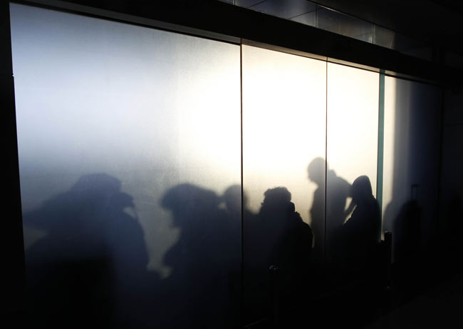 People wait for flight at Cairo International Airport on January 31, 2011 in Cairo, Egypt. [Photo/Xinhua] 