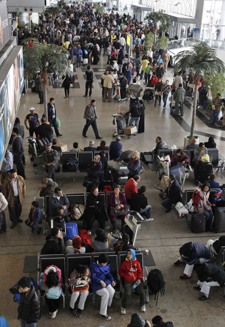 People wait for flight at Cairo International Airport on January 31, 2011 in Cairo, Egypt. [Photo/Xinhua] 