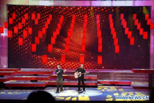 A singing group titled 'Xuriyanggang' perform during a rehearsal of the Spring Festival Gala Evening at China Central Television (CCTV) in Beijing, capital of China, Jan. 31, 2011.