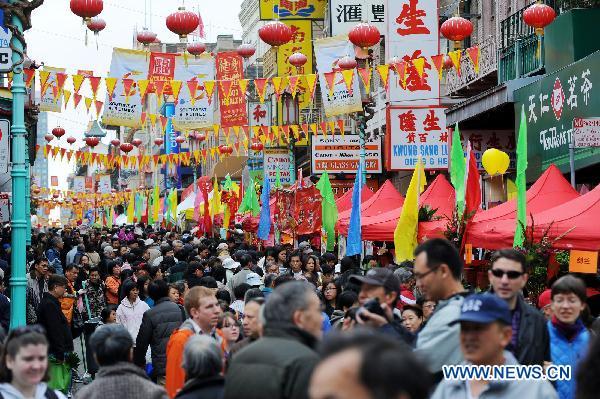 People visit a fair celebrating the Chinese Lunar New Year held in the Chinatown in San Francisco, the United States, Jan. 30, 2011.