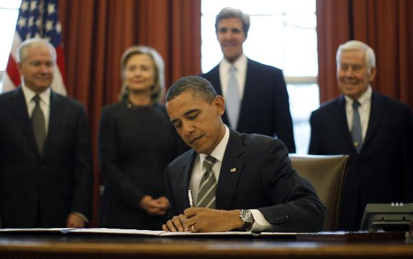 President Barack Obama signs the New START Treaty in the Oval Office of the White House in Washington, Wednesday, Feb. 2, 2011.