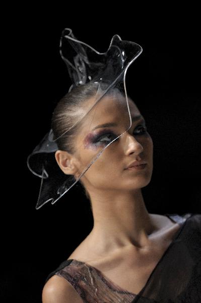 A model presents a creation by designer Fernanda Yamamoto during the closing day of 2011-2012 Fall-Winter collections of the Sao Paulo Fashion Week in Sao Paulo, Brazil, on February 2, 2011.