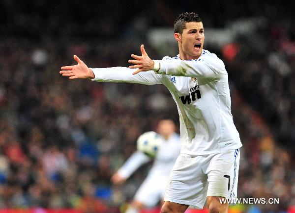 Real Madrid's Portuguese forward Cristiano Ronaldo reacts during the Spanish King's Cup semifinal second-leg football match between Real Madrid and Sevilla at the Santiago Bernabeu stadium in Madrid, capital of Spain, Feb. 2, 2011. Real Madrid won 2-0.