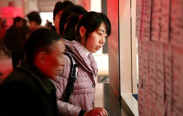 Migrant workers at the Andemen migrant workers' job market in Nanjing, Jiangsu Province, Tuesday, Feb. 8, 2011. More than 2,000 migrant workers from all over the region have come to the Andemen job market to find jobs.