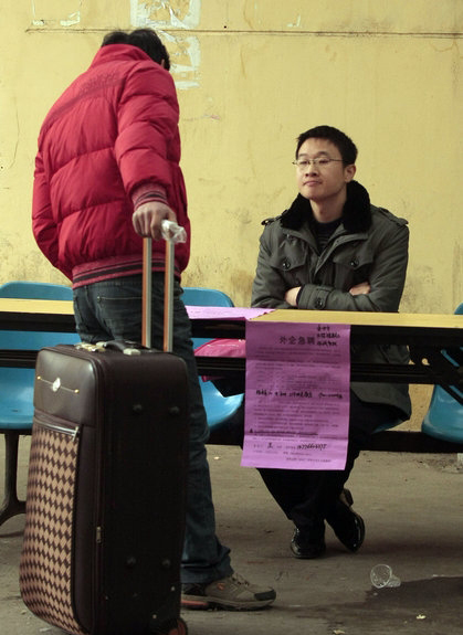 A migrant worker at the Andemen migrant workers' job market in Nanjing, Jiangsu Province, Tuesday, Feb. 8, 2011.