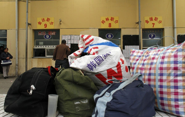 Migrant workers' bags at the Andemen migrant workers' job market in Nanjing, Jiangsu Province, Tuesday, Feb. 8, 2011.
