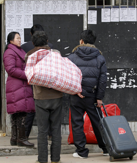 Migrant workers at the Andemen migrant workers' job market in Nanjing, Jiangsu Province, Tuesday, Feb. 8, 2011. 