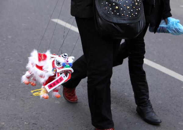 A little lion made of clothes is seen in the annual Chinese Spring Festival Parade in Paris, capital of France, Feb. 6, 2011. Chinese French associations organized on Sunday the annual parade to celebrate the Chinese Lunar New Year, the Year of the Rabbit. 