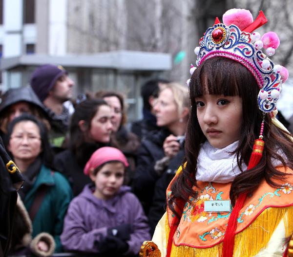 A girl who dressed herself up participates in the annual Chinese Spring Festival Parade in Paris, capital of France, Feb. 6, 2011. Chinese French associations organized on Sunday the annual parade to celebrate the Chinese Lunar New Year, the Year of the Rabbit.