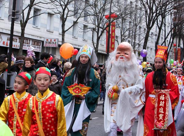 People participate in the annual Chinese Spring Festival Parade in Paris, capital of France, Feb. 6, 2011. Chinese French associations organized on Sunday the annual parade to celebrate the Chinese Lunar New Year, the Year of the Rabbit. 