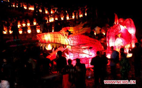 A dragon lantern carried by wooden benches is seen during a lantern parade in Dexing, east China's Jiangxi Province, Feb. 8, 2011. Over 200 people took part in a lantern parade celebrating the Chinese Lunar New Year here on Tuesday.