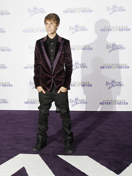 Singer Justin Bieber poses at the premiere of the documentary 'Justin Bieber: Never Say Never' at Nokia theatre in Los Angeles February 8, 2011. The documentary opens in the U.S. on February 11.