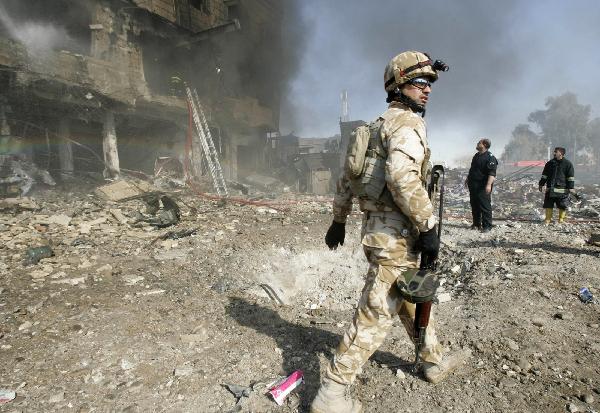 ShareretweetEmailPrint Iraqi soldier patrols site An Iraqi soldier patrols the site of a bomb attack in Kirkuk, some 250 km (155 miles) north of Baghdad February 9, 2011. [Xinhua]