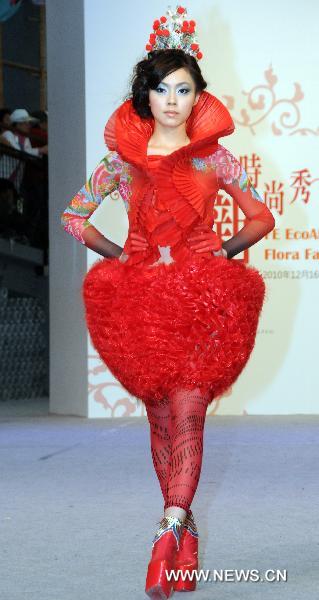 A model presents a creation designed by Jasper Huang during a fashion show held in the fashion pavilion of Taipei International Flora Expo in Taipei, southeast China's Taiwan, Feb. 9, 2011. Taiwanese fashion designer Jasper Huang showcased on Wednesday a series of evening dresses and little dresses which he created on the basis of inspirations he got from Chinese traditional aesthetics.