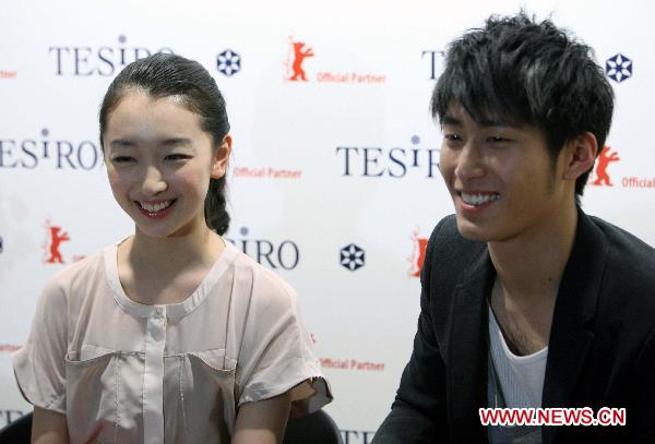 Actor Dou Xiao (R) and actress Zhou Dongyu from Chinese film 'Under the Hawthorn Tree' are seen during an interview at Berlin Film Festival in Germany, Feb. 11, 2011. The film from former Golden Bear winner Zhang Yimou, will be shown as part of the Generation 14Plus section during the film festival.