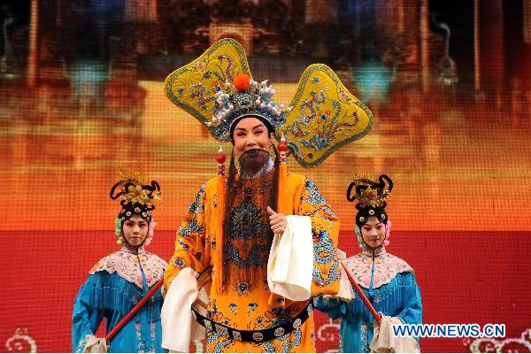 Jinju Opera performer Xie Tao (C) acts during a folk drama performance in Taiyuan, capital of north China's Shanxi Province, Feb. 11, 2011. 