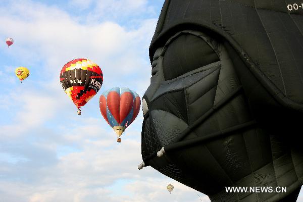 A Darth Vader-shaped hot-air balloon float in the sky during the 16th Philippine International Hot-Air Balloon Fiesta at the Clark Freeport Zone in Pampanga, north of Manila, the Philippines, Feb. 10, 2011. 