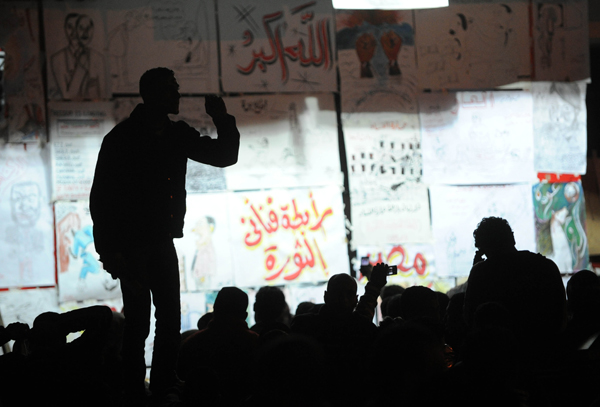 People celebrate the resignation of Egyptian President Hosni Mubarak on Tahrir Square in Cairo, Egypt, Feb. 11, 2011. Egypt's President Hosni Mubarak steps down and the military take charge of the country, Egypt's Vice President Omar Suleiman said on Friday afternoon. [Xinhua photo]