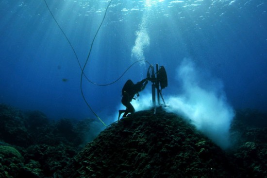 Australian Institute Of Marine Science (AIMS) divers examine cores of large Porites coral at Clerke Reef, Western Australia, in this handout photo released to Reuters February 10, 2011. Flood and storm-battered northern Australia is likely to suffer more frequent weather extremes, according to a study of coral cores that reveal a centuries-old climate record for the region.