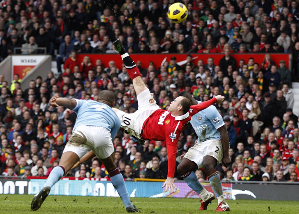 Manchester United's Wayne Rooney scores against Manchester City from an overhead kick during their English Premier League soccer match at Old Trafford in Manchester, northern England, February 12, 2011.