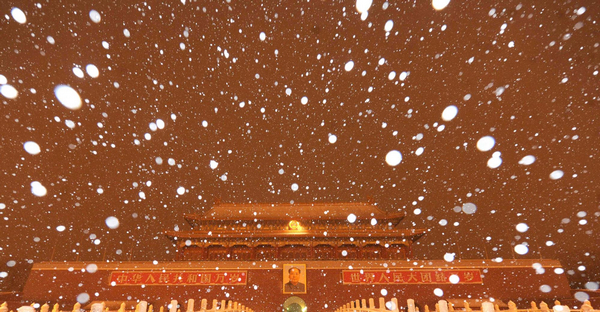 Snow flies over the Tian'anmen Square in Beijing, capital city of China, Feb 13. Beijing sees the second snowfall of this year at late night of Feb 12, 2011. 