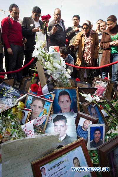 Local residents mourn for victims at Tahrir Square in Cairo, Egypt, Feb. 12, 2011. People continued celebrating the resignation of Egyptian President Hosni Mubarak on Tahrir Square Saturday. Egypt&apos;s President Hosni Mubarak steps down and the military take charge of the country, Egypt&apos;s Vice President Omar Suleiman said on Friday afternoon.