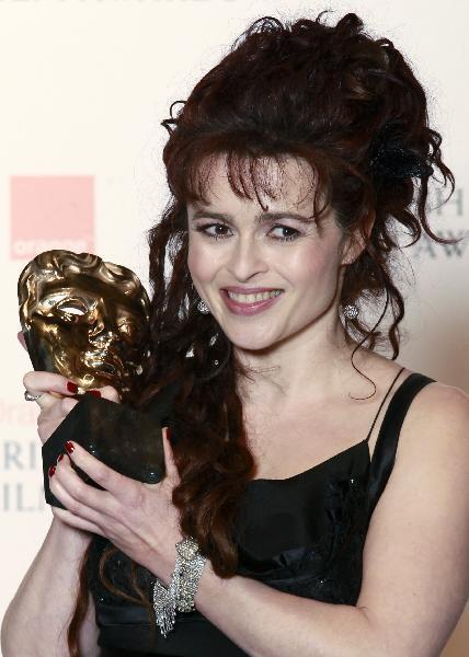 Helena Bonham Carter poses with her award for best supporting actress for her role in 'The King's Speech' at the British Academy of Film and Television Arts (BAFTA) award ceremony at the Royal Opera House in London, February 13, 2011.