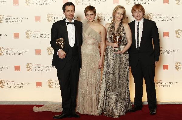 Author J.K. Rowling (2nd R), producer David Heyman (L), actress Emma Watson (2nd L) and actor Rupert Grint pose after Rowling and Heyman received an award for outstanding contribution to British cinema at the British Academy of Film and Television Arts (BAFTA) award ceremony at the Royal Opera House in London February 13, 2011.