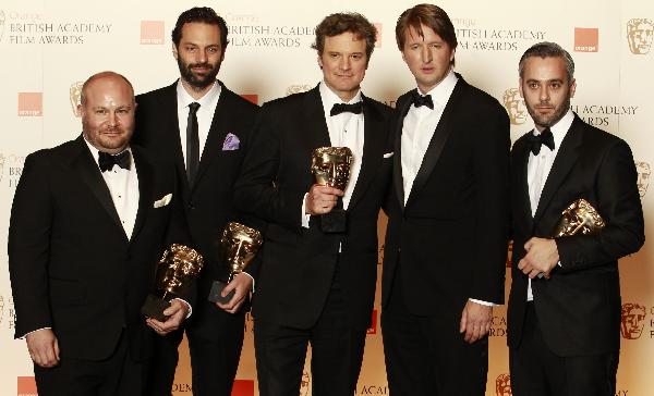 Actor Colin Firth (C) holds the award for best actor for the 'King's Speech' as he stands with the film's director Tom Hooper (2nd R) and producers Gareth Unwin (L), Emile Sherman (2nd L), Iain Canning (R) at the British Academy of Film and Television Arts (BAFTA) award ceremony at the Royal Opera House in London February 13, 2011.