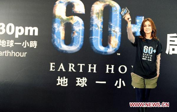 Hong Kong singer Kay Tse waves at the launching ceremony of WWF (World Wildlife Fund) Earth Hour in Hong Kong, south China, Feb. 13, 2011. Earth Hour, a global initiative powered by WWF to enhance people&apos;s support for environmentally sustainable action, will fall on 8:30 p.m. of March 26 this year. 