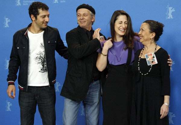 Cast members Fahri Yardim (L to R), Vedat Erincin, Demet Guel, and Lilay Huser pose during a photocall to promote the movie 'Almanya - Willkommen in Deutschland ' (Welcome to Germany) at the 61st Berlinale International Film Festival in Berlin February 12, 2011. The Berlinale International Film Festival runs from February 10 to 20, 2011.