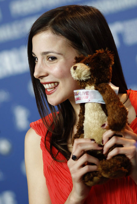 Actress Aylin Tezel holds a teddy bear which she received from a Kids-TV channel during a news conference to promote the movie 'Almanya - Willkommen in Deutschland ' (Welcome to Germany) at the 61st Berlinale International Film Festival in Berlin February 12, 2011. The Berlinale International Film Festival runs from February 10 to 20, 2011.