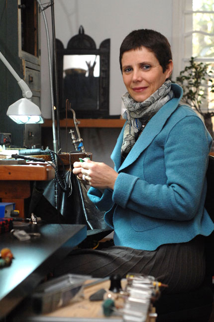 French jewelry designer Helene Dumenil works at her studio in Shanghai. Dumenil's works often have African influence. [Shanghai Daily]