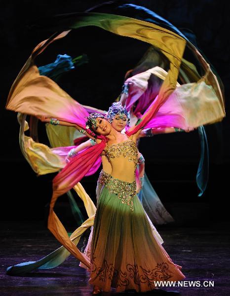 Actresses of China's Gansu Opera House dance during a performance of thematic singing and dancing Dunhuang Melody in Belgrade, Feb. 14, 2011. The Dunhuang Melody is one part of Happy Spring Festival series in Serbia which are organized by Chinese embassy. [Xinhua/Marko Rupena]
