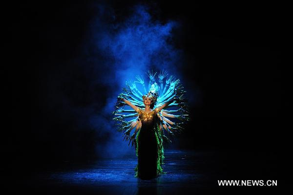 Actresses of China's Gansu Opera House dance during a performance of thematic singing and dancing Dunhuang Melody in Belgrade, Feb. 14, 2011. The Dunhuang Melody is one part of Happy Spring Festival series in Serbia which are organized by Chinese embassy. [Xinhua/Marko Rupena]