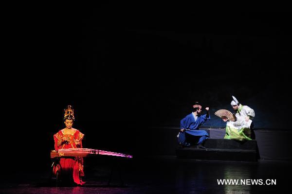 Actors of China's Gansu Opera House act during a performance of thematic singing and dancing Dunhuang Melody in Belgrade, Feb. 14, 2011. The Dunhuang Melody is one part of Happy Spring Festival series in Serbia which are organized by Chinese embassy. [Xinhua/Marko Rupena]
