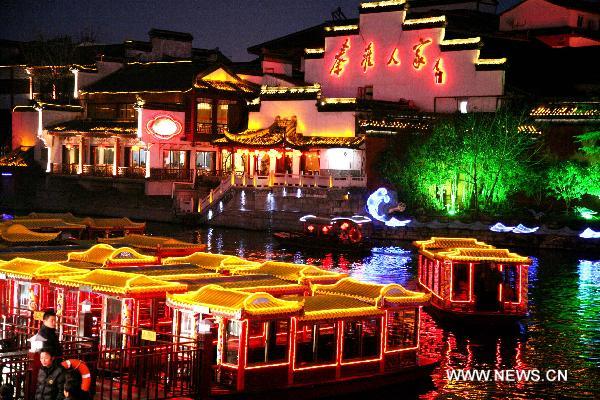 Photo taken on Feb. 15, 2011 shows colorful lanterns at the Confucius Temple scenic area in Nanjing, capital of east China's Jiangsu Province. Lanterns were lit at the area to celebrate the upcoming Lantern Festival that falls on Feb. 17, 2011. [Wang Xin/Xinhua]