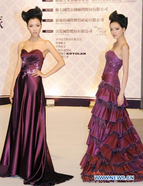 Chinese mainland models present wedding dresses during a fashion show at the ongoing International Flower Expo in Taipei, southeast China's Taiwan, Feb. 15, 2011.