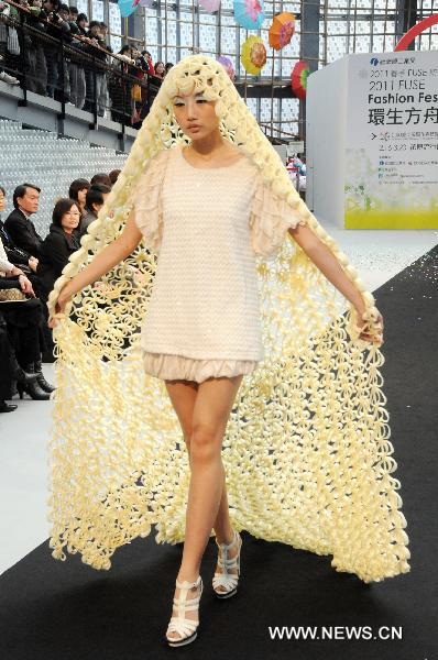 A model catwalks during the 2011 FUSE Fashion Festival in Taipei, southeast China's Taiwan, Feb. 16, 2011. The 33-day fashion event kicked off here Wednesday, to highlight designs by fashion students at a dozen of Taiwan's colleges.