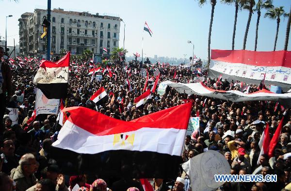 Egyptian pro-democracy supporters gather in front of Leader Ibrahim mosque in Alexandria, Egypt, Feb. 18, 2011.