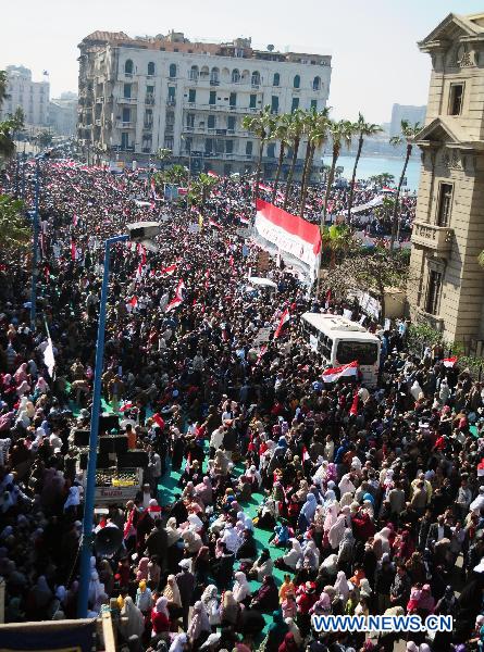 Egyptian pro-democracy supporters gather in front of Leader Ibrahim mosque in Alexandria, Egypt, Feb. 18, 2011.