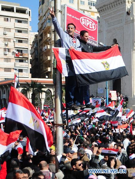 Egyptian pro-democracy supporters gather in front of Leader Ibrahim mosque in Alexandria, Egypt, Feb. 18, 2011. 