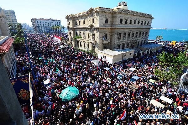 Egyptian pro-democracy supporters gather in front of Leader Ibrahim mosque in Alexandria, Egypt, Feb. 18, 2011. 