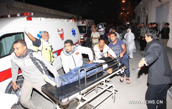 A wounded protestor is being sent to a hospital in Manama, capital of Bahrain, Feb. 18, 2011. Dozens of protestors were wounded in a clash between protestors and soldiers and police on Friday at Pearl Square in Manama. 