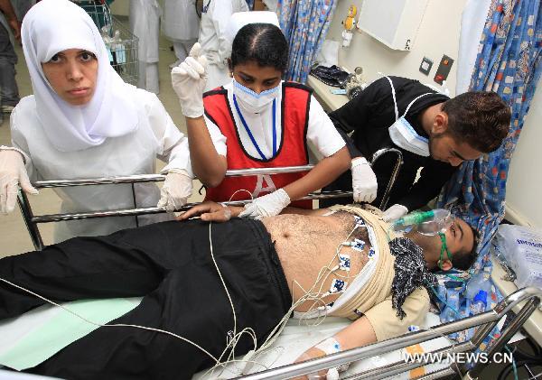 A wounded protestor is being sent to a hospital in Manama, capital of Bahrain, Feb. 18, 2011. Dozens of protestors were wounded in a clash between protestors and soldiers and police on Friday at Pearl Square in Manama. 