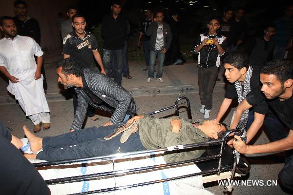 A wounded protestor is being sent to a hospital in Manama, capital of Bahrain, Feb. 18, 2011. Dozens of protestors were wounded in a clash between protestors and soldiers and police on Friday at Pearl Square in Manama.