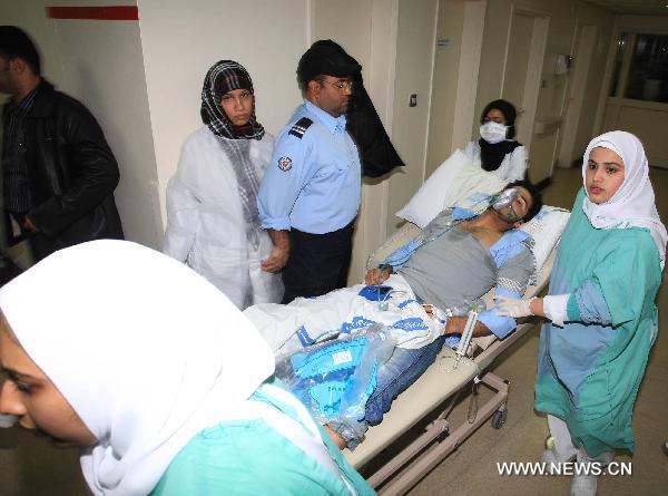 A wounded protestor is being sent to a hospital in Manama, capital of Bahrain, Feb. 18, 2011. Dozens of protestors were wounded in a clash between protestors and soldiers and police on Friday at Pearl Square in Manama.