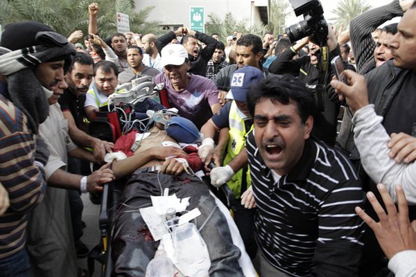 A wounded protestor is being sent to a hospital in Manama, capital of Bahrain, Feb. 18, 2011. Dozens of protestors were wounded in a clash between protestors and soldiers and police on Friday at Pearl Square in Manama.