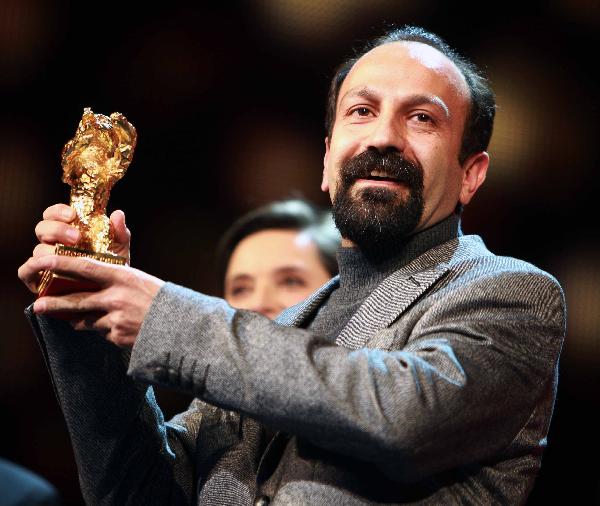 Iranian director Asghar Farhadi poses with Golden Bear award during the awards ceremony at the 61st Berlinale International Film Festival in Berlin, capital of Germany, Feb. 19, 2011. 'Jodaeiye Nader az Simin' (Nader And Simin, A Separation) from Iran's Asghar Farhadi won the Golden Bear, the highest prize awarded for the best film at the film festival Saturday night. [Xinhua]